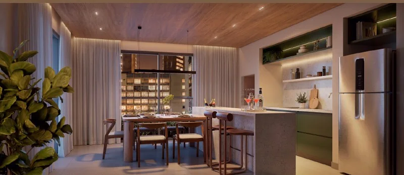 Espaço gourmet do Q Studios com mesa de jantar e bancada